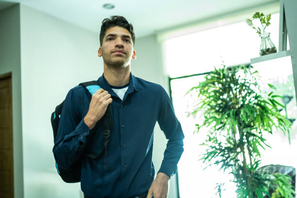 Young man getting ready to go out at home