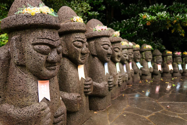 Dol Hareubang stone statues on Jeju Island stock photo