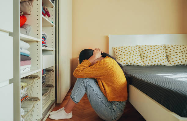 istock Depressed girl at home 1471236492
