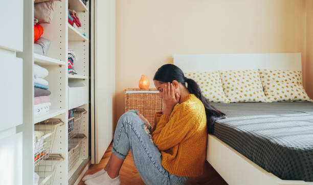 istock Depressed girl at home 1471236739