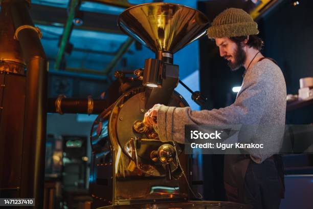 Male Barista Roasting The Raw Coffee Beans Stock Photo - Download Image Now - Coffee Roaster, Machinery, Only Men