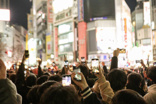 istock Massive Crowd Of People Using Smart Phone 1471237857