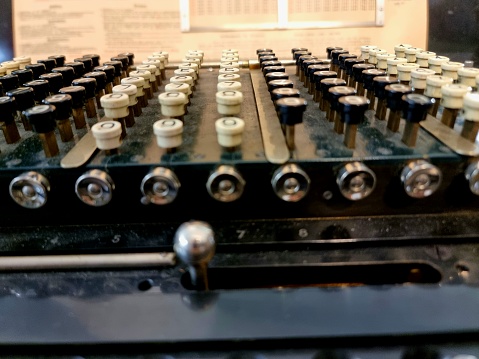 Vintage computing machine close-up image with typ buttons. Used in the pre Computer Era.