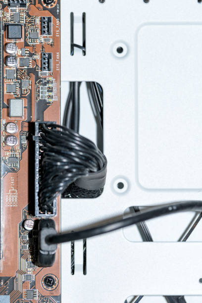 istock Printed circuit board connected to wire connectors on motherboard 1471244450