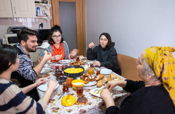 istock Muslim family members talking to each other at breakfast table 1471245558