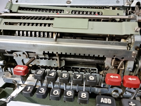 Vintage computing machine with several keys.