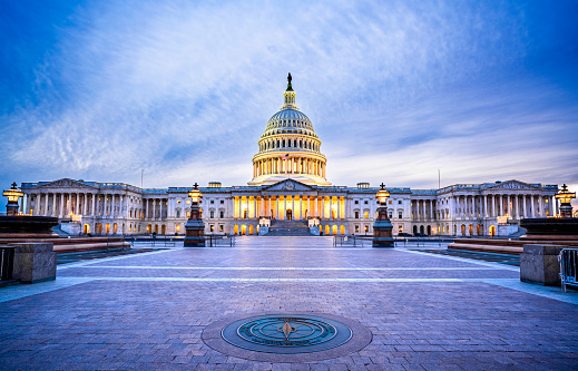 Capital building in Washington DC city at night wiht street and cityscape, USA, United states of Amarica