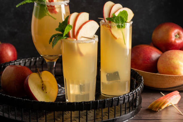 istock Three glasses of refreshing apple cocktail drinks with fresh red apples, dark background 1471252457