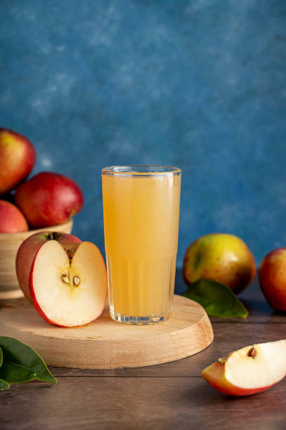 Apple cocktail, juice drink with fresh red apples Apple cocktail, juice drink with fresh red apples. Cardamom stock pictures, royalty-free photos & images