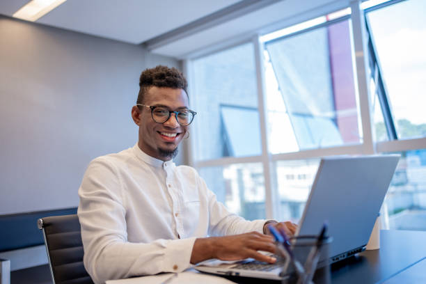 istock Young black businessman working in modern office 1471254962