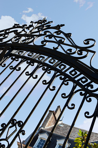 Weathered black wrought iron gate