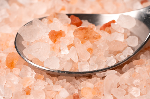 close up picture of a wooden bowl containing pink salt from the Himalayas  (this picture has been taken with a Hasselblad H3D II 31 megapixels camera)