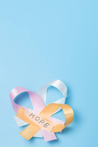 istock Three ribbons with the word hope on a blue background. 1471261983