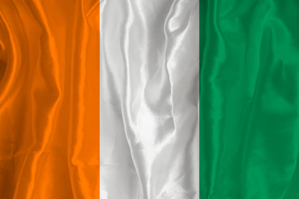 istock The Cote devoir flag on a silk background is a great national symbol. Fabric texture The official state symbol of the country 1471262194