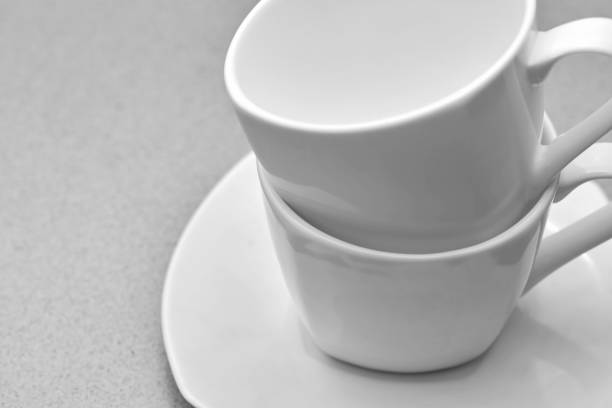 istock two white coffee mugs in black and white 1471272451