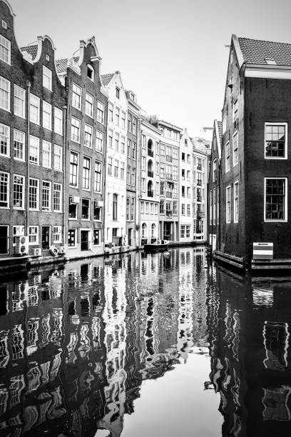 istock Old houses by canal in Amsterdam 1471273079