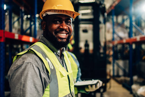 istock Portrait of warehouse worker smiling looking camera 1471276654