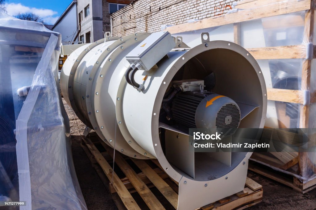 Fan production equipment. Cooling fan of condition or heating and drying system in warehouse Fan production equipment. Cooling fan of condition or heating and drying system in warehouse. Cereal Plant Stock Photo