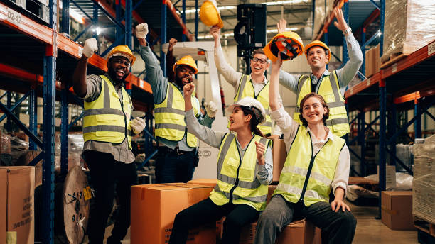 istock Professional warehouse worker team celebrating success in warehouse factory 1471279238