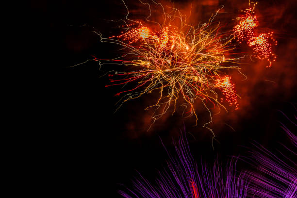 colorful fireworks display on a party night stock photo