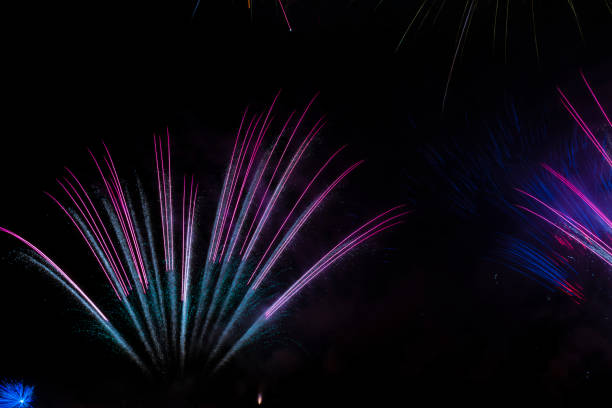 colorful fireworks display on a party night stock photo