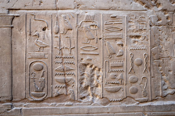 istock Egyptian Hieroglyphics written on a wall 1471283296