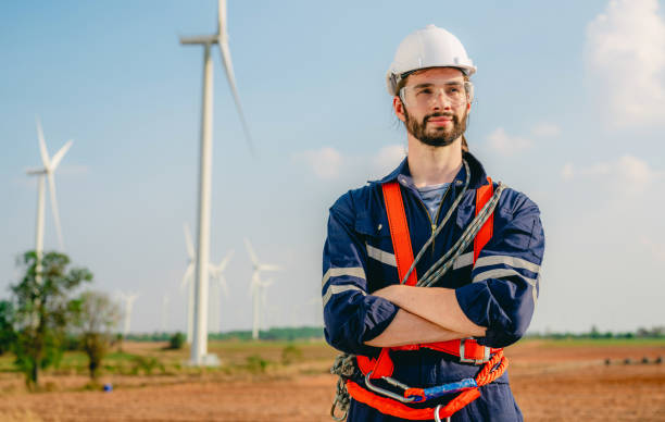 istock Professional engineer technician working outdoor at wind turbine field 1471284176