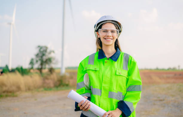 istock Professional engineer technician working outdoor at wind turbine field 1471284240