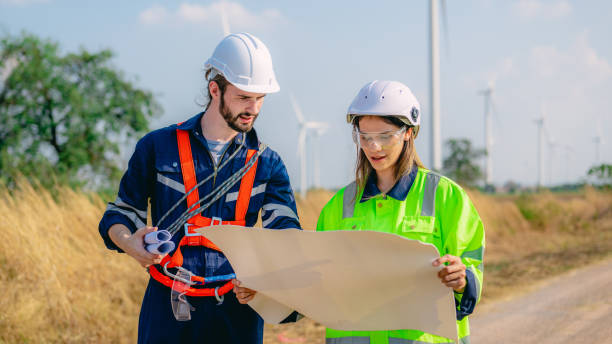 istock Professional engineer technician working outdoor at wind turbine field 1471284671