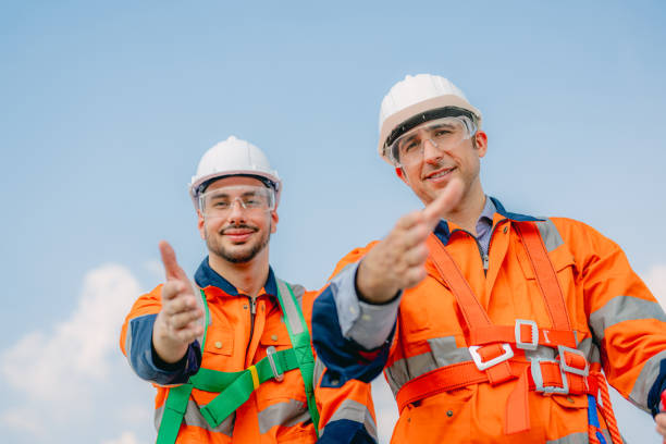 istock Professional engineer technician working outdoor at wind turbine field 1471284823