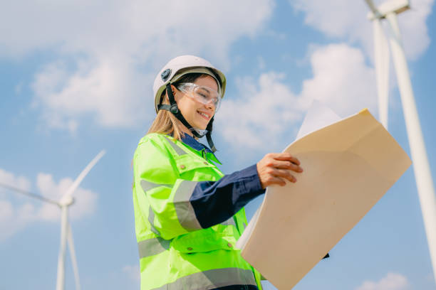 istock Professional engineer technician working outdoor at wind turbine field 1471286799