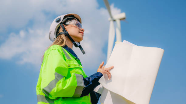 istock Professional engineer technician working outdoor at wind turbine field 1471287388