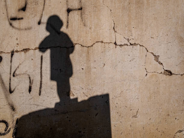 istock The shadow of a figure on the wall 1471288193