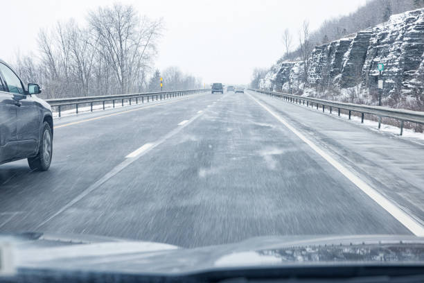 snowfall on the road, slippery way with car