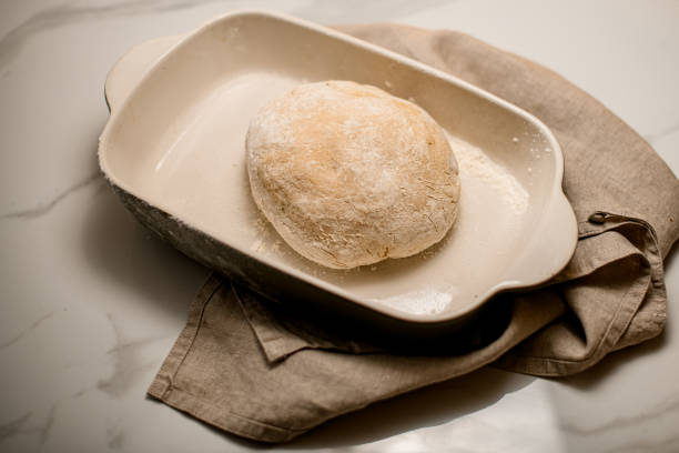 istock close-up top view of raw dough in a ceramic baking dish on the table 1471291547