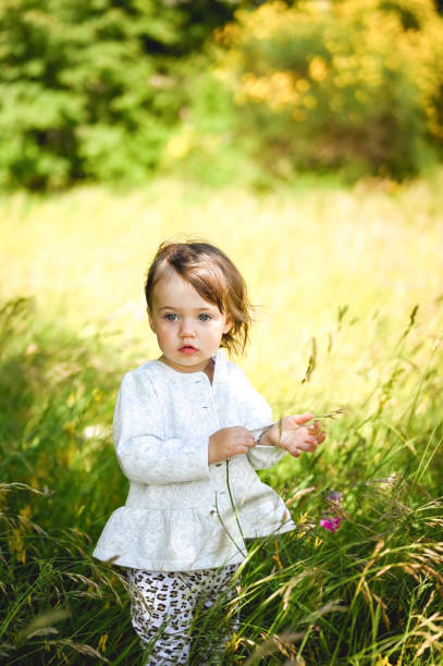 istock little child in a sunny field. 1471293806