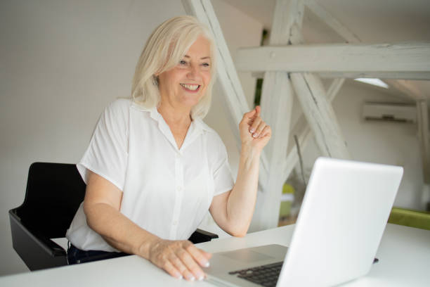 istock Senior woman working from home 1471298235