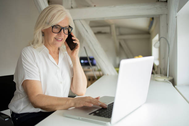 istock Senior woman working from home 1471298243