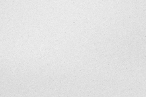 White recycled craft paper texture as background. Grey paper texture material, Old vintage page light wrinkle tone vignette of old newspaper and journal blank. Paperwork pattern letter for text.