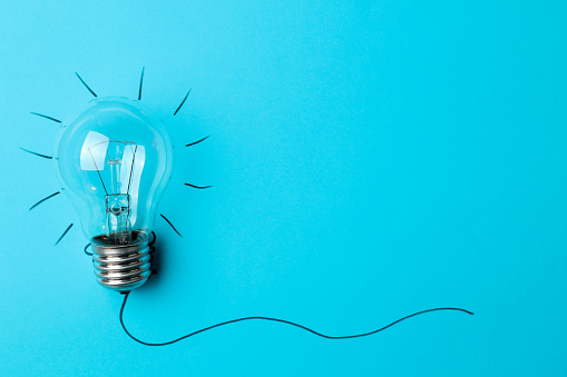 Concept creative idea. concept of creative idea. light bulb on a blue background. metaphor, inspiration. space for text