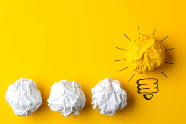 istock Concept creative idea. concept of creative idea. Crumpled paper balls and painted light bulb on bright background. metaphor, inspiration. 1471298878