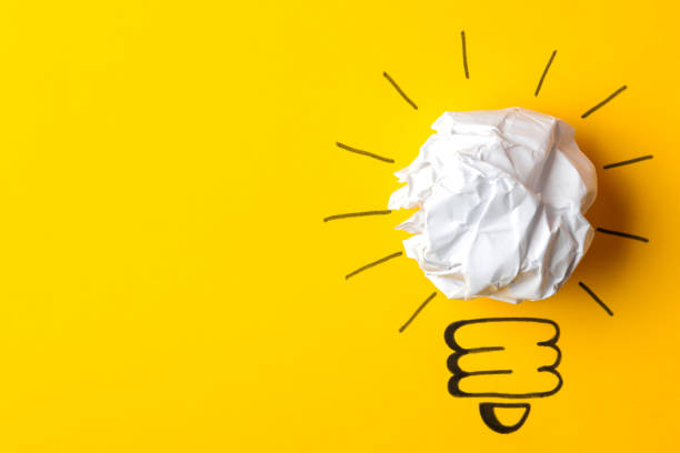istock Concept creative idea. concept of creative idea. Crumpled paper balls and painted light bulb on bright background. metaphor, inspiration. 1471298880