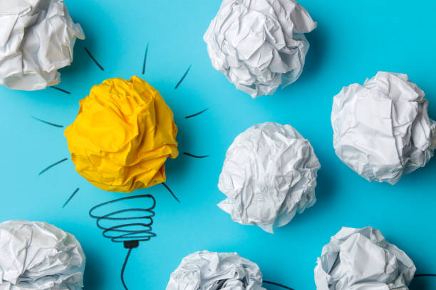 istock Concept creative idea. concept of creative idea. Crumpled paper balls and painted light bulb on bright background. metaphor, inspiration. 1471298889