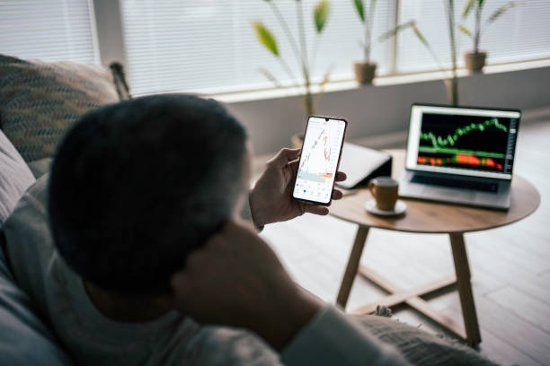 istock Stock trading. Trader studying stock market on TradingView app. 1471299076