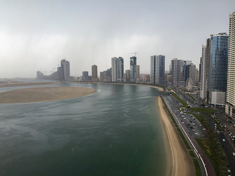 Apartment buildings on Al Khan Lagoon, Sharjah, on a rainy afternoon