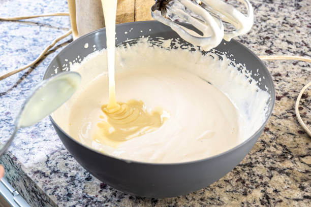 istock Creamy ingredient being poured into the cheesecake pan. 1471304997