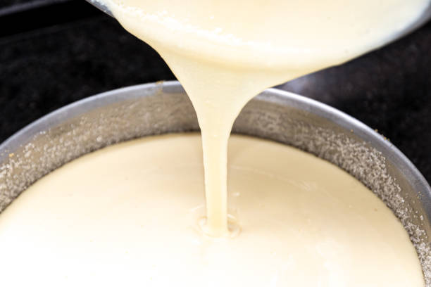 istock Creamy ingredient being mixed to make cheesecake. Plastic utensil. 1471305006