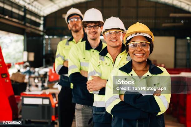 Group Of Confident Engineers Workers Smiling Stock Photo - Download Image Now - Maintenance Engineer, Group Of People, Smiling