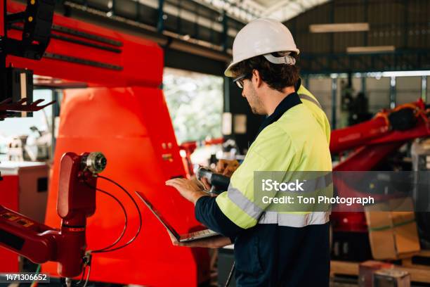 Engineer Reparing Machine Technician Engineer Checking And Repairing Automatic Robotic Machine ...