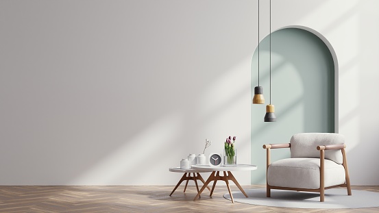 Sala de estar escandinava con sillón gris sobre fondo de pared blanco vacío. photo